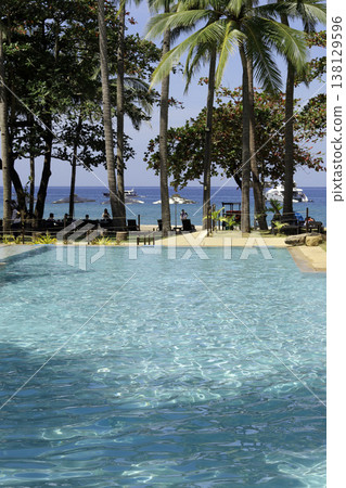 beautiful tropical beach and sea with coconut palm tree beautiful tropical beach and sea with coconut palm tree 138129596