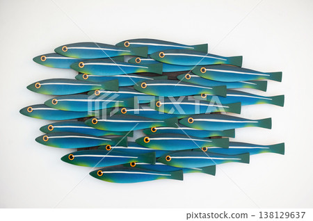 Unique handcrafted wooden wall art panel featuring a school of stylized turquoise and blue fish with yellow accents on a white background. Unique handcrafted wooden wall art panel featuring a school of stylized turquoise and blue fish with yellow accents on a white background. 138129637