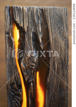 Close-up macro shot of a decorative wooden lamp made from a weathered slab, focusing on the deep wood grain textures and a glowing warm orange light emanating from an internal crevice. Close-up macro shot of a decorative wooden lamp made from a weathered slab, focusing on the deep wood grain textures and a glowing warm orange light emanating from an internal crevice. 138129666
