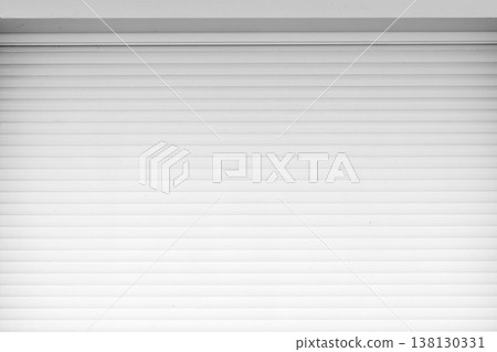 Closed white roller shutter garage door background photo Closed white roller shutter garage door background photo 138130331