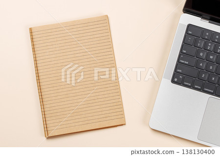 Blank notepad, laptop and stationery on beige workspace, top view with copy space Blank notepad, laptop and stationery on beige workspace, top view with copy space 138130400