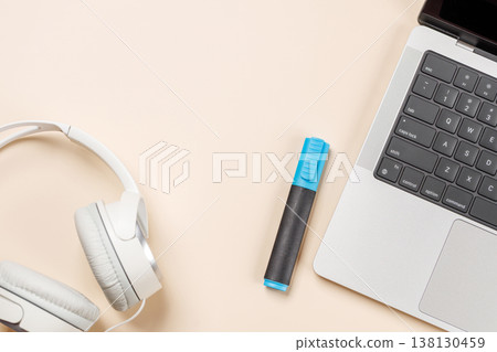 Laptop and stationery on beige workspace, top view with copy space Laptop and stationery on beige workspace, top view with copy space 138130459