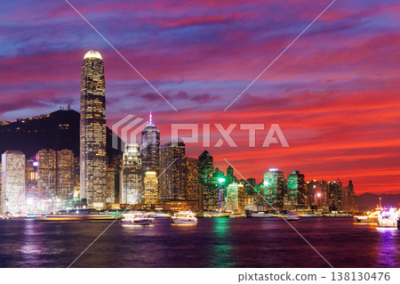 Hong Kong city skyline at sunset with glowing sky and skyscrapers Hong Kong city skyline at sunset with glowing sky and skyscrapers 138130476
