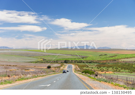 Asphalt road in South Africa surrounded by fields 138130495