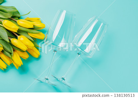 White wine glasses with yellow tulips White wine glasses with yellow tulips 138130513