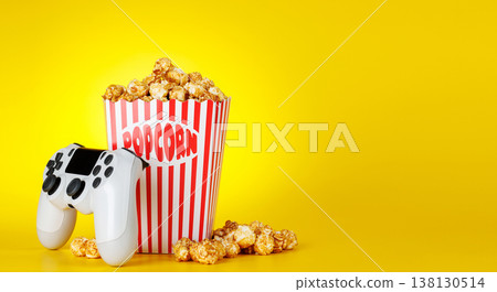 Popcorn and gamepad on yellow background 138130514