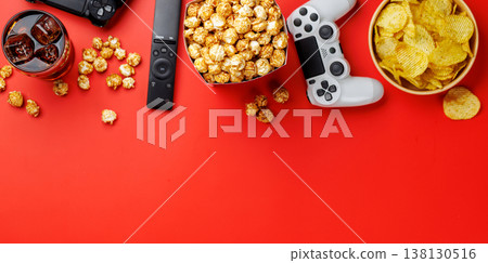 Popcorn, cola and gamepad on red background Popcorn, cola and gamepad on red background 138130516