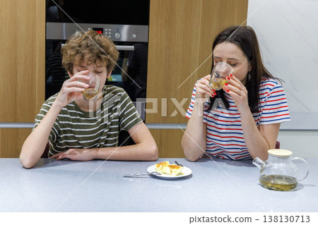 Mother and son drinking tea at home Mother and son drinking tea at home 138130713