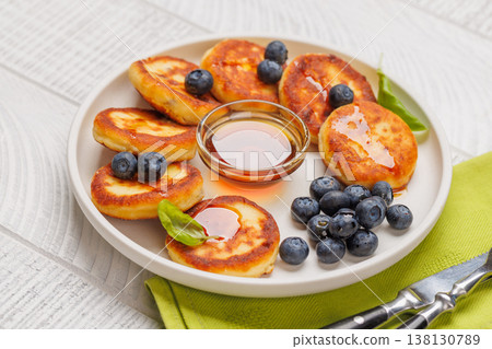 Homemade pancakes with blueberries and syrup Homemade pancakes with blueberries and syrup 138130789