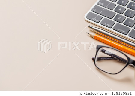 Office supplies on beige desk Office supplies on beige desk 138130851