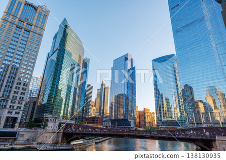 Vibrant sunny view of Chicago downtown skyline under a blue sky Vibrant sunny view of Chicago downtown skyline under a blue sky 138130935