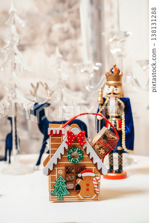 Whimsical Gingerbread House And Nutcracker With Icing Details And Candy Accents, Miniature Reindeer Whimsical Gingerbread House And Nutcracker With Icing Details And Candy Accents, Miniature Reindeer 138131288