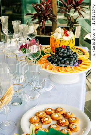 Elegant Open Air Brunch Display Featuring Seasonal Fruits And Sparkling Beverages Elegant Open Air Brunch Display Featuring Seasonal Fruits And Sparkling Beverages 138131576