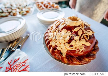 Braided Almond Loaf On Wooden Board With Golden Crust And Toasted Almond Slices Presented . Braided Almond Loaf On Wooden Board With Golden Crust And Toasted Almond Slices Presented . 138131586