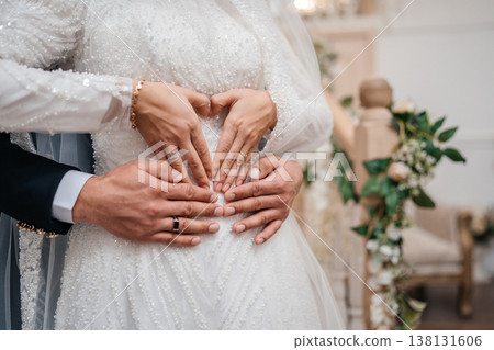 Multiple Hands Forming Heart Shape Over Waist, Layered Rings And Beaded Gown, Emotional Connection . Multiple Hands Forming Heart Shape Over Waist, Layered Rings And Beaded Gown, Emotional Connection . 138131606