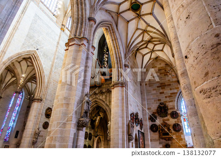 Interior view of Ulm Cathedral in Germany. Features ornate ceiling, detailed stone carvings, and stained glass windows. Gothic architecture highlights Interior view of Ulm Cathedral in Germany. Features ornate ceiling, detailed stone carvings, and stained glass windows. Gothic architecture highlights 138132077