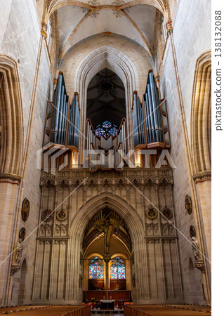 Interior view of Ulm Cathedral in Germany. Features ornate ceiling, detailed stone carvings, and stained glass windows. Gothic architecture highlights 138132088