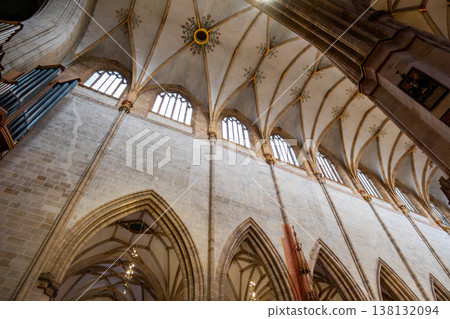 Interior view of Ulm Cathedral in Germany. Features ornate ceiling, detailed stone carvings, and stained glass windows. Gothic architecture highlights Interior view of Ulm Cathedral in Germany. Features ornate ceiling, detailed stone carvings, and stained glass windows. Gothic architecture highlights 138132094