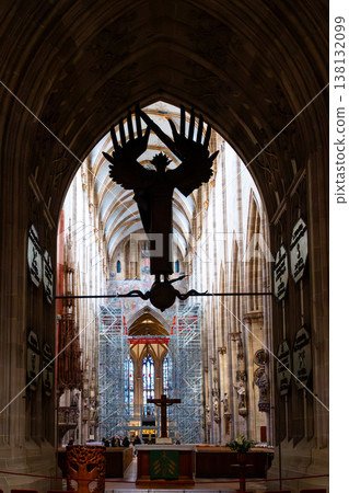 Interior view of Ulm Cathedral in Germany. Features ornate ceiling, detailed stone carvings, and stained glass windows. Gothic architecture highlights 138132099