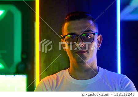 Young Man Portrait With Glasses In Neon Club Lighting Looking Confident And Thoughtful Young Man Portrait With Glasses In Neon Club Lighting Looking Confident And Thoughtful 138132243