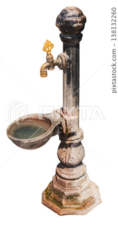 An old water fountain made of stone. It has a spout for water and a basin below. The design is simple and it stands on a solid base An old water fountain made of stone. It has a spout for water and a basin below. The design is simple and it stands on a solid base 138132260
