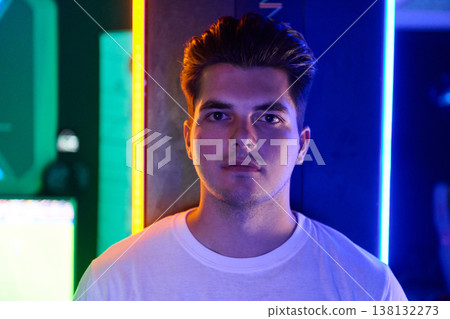 Young Man Portrait in Neon Lights With Urban Night Mood and Colorful Backdrop Young Man Portrait in Neon Lights With Urban Night Mood and Colorful Backdrop 138132273
