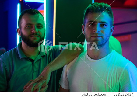 Two Friends Posing in Neon Portrait at Nightclub With Colorful Ambient Lighting and Casual Style Two Friends Posing in Neon Portrait at Nightclub With Colorful Ambient Lighting and Casual Style 138132434