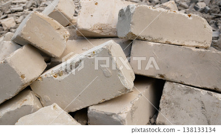 A pile of bricks lies on the ground. A pile of bricks lies on the ground. 138133134