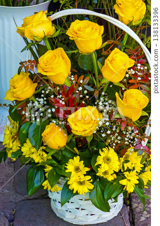 Yellow roses in basket Yellow roses in basket 138133396