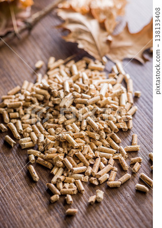 Wood Pellets Pile for Biofuel Heating and Renewable Energy Closeup on Rustic Wooden Surface Wood Pellets Pile for Biofuel Heating and Renewable Energy Closeup on Rustic Wooden Surface 138133408