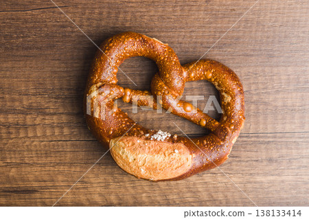 Salted German Pretzel On Rustic Wooden Table, Fresh Baked Bakery Bread Snack 138133414