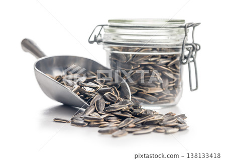 Sunflower Seeds In Metal Scoop With Glass Jar Spilling Healthy Snack And Rustic Storage 138133418