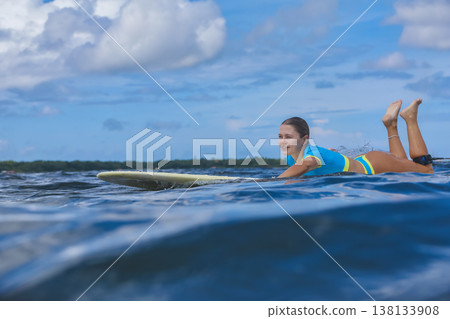 Young Woman Floating On Gentle Seas During Quiet Retreat 138133908