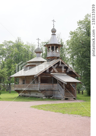 Serene rural chapel featuring weathered logs and bell tower design Serene rural chapel featuring weathered logs and bell tower design 138133939