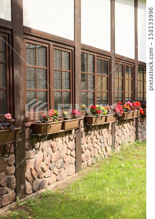 Idyllic countryside cottage with vibrant flower displays Idyllic countryside cottage with vibrant flower displays 138133996