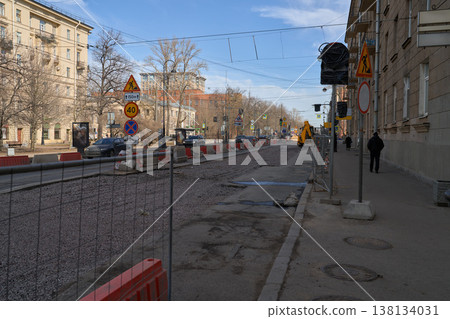 City Street Scene. Sidewalk Adjacent To Fencing As Pedestrians Navigate Uneven Surface In City Environment City Street Scene. Sidewalk Adjacent To Fencing As Pedestrians Navigate Uneven Surface In City Environment 138134031