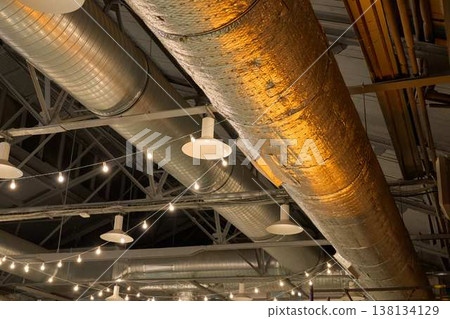 Industrial Ceiling Design. Contemporary Industrial Interior Highlighting Exposed Ductwork And Lighting 138134129