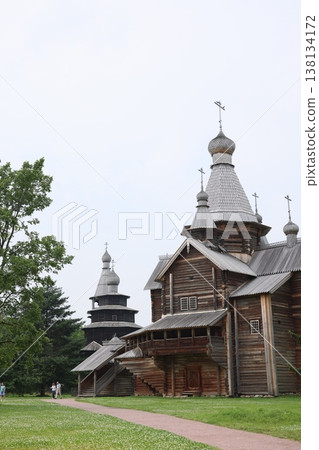 Spiked wooden structures stretch into open sky alongside soaring bird Spiked wooden structures stretch into open sky alongside soaring bird 138134172