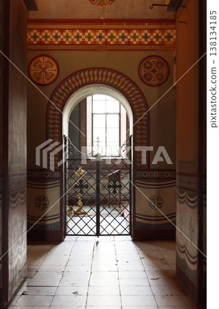 Sunlit corridor featuring intricate design elements and patterns 138134185