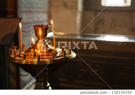 Peaceful scene of glowing candles illuminating sacred space 138134193
