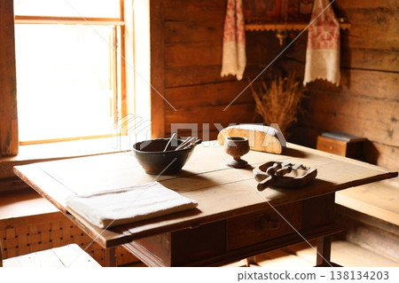 Bright farmhouse with bread. Morning glow over rustic table setting 138134203