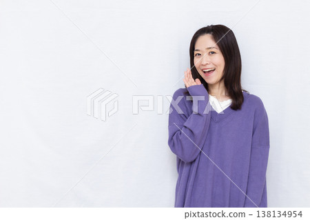 Smiling woman whispering Smiling woman whispering 138134954
