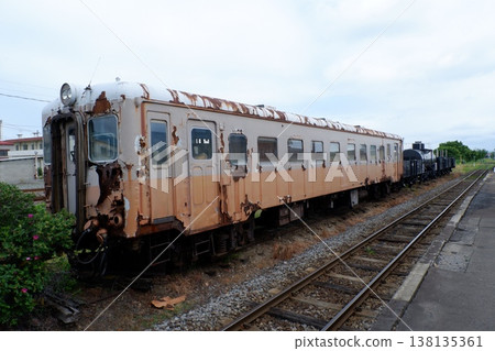 A KiHa 22 diesel railcar parked at Tsugaru Goshogawara Station. A KiHa 22 diesel railcar parked at Tsugaru Goshogawara Station. 138135361