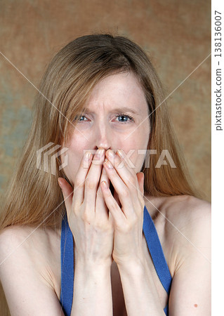 Female showing disgust expression on her face 138136007