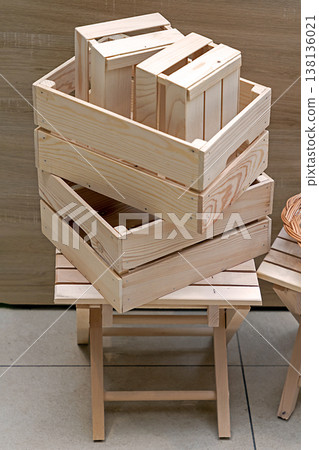 Empty wooden crates in corner 138136021