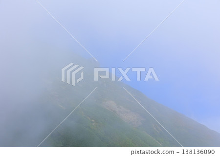 A mountain floating in the sea of clouds A mountain floating in the sea of clouds 138136090