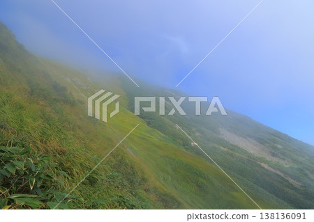 A mountain floating in the sea of clouds A mountain floating in the sea of clouds 138136091