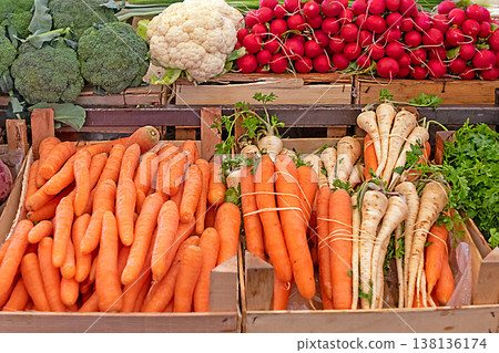 Fresh vegetables in wooden crates on market 138136174