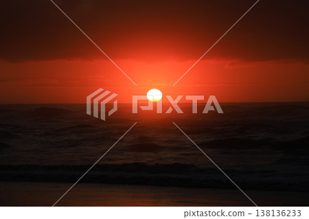 Clouds visible beyond the sunrise sky and the sea. Clouds visible beyond the sunrise sky and the sea. 138136233