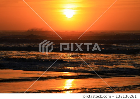 Clouds visible beyond the sunrise sky and the sea. Clouds visible beyond the sunrise sky and the sea. 138136261